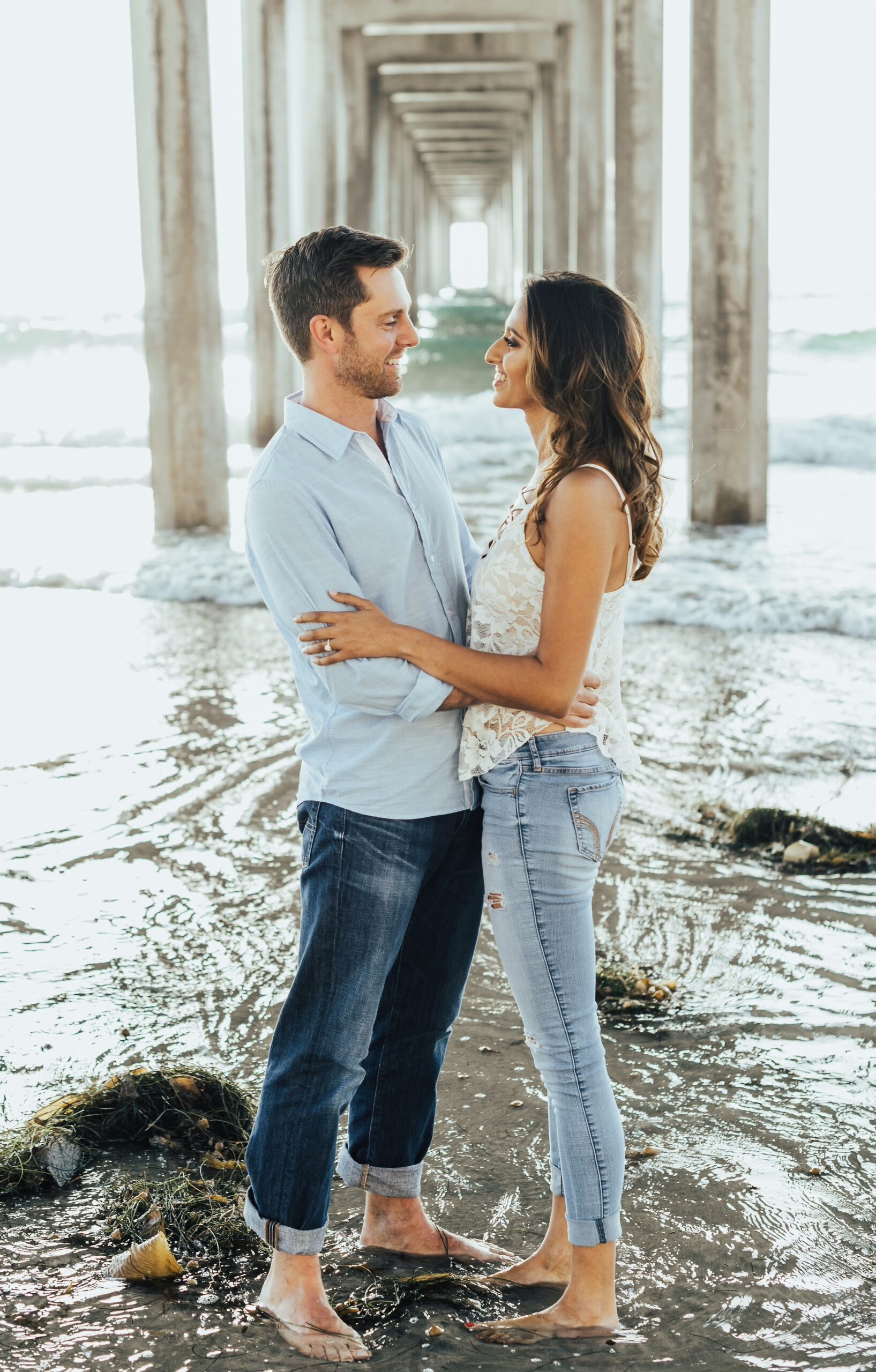 Pam and Matt smiling on the beach in La Jolla